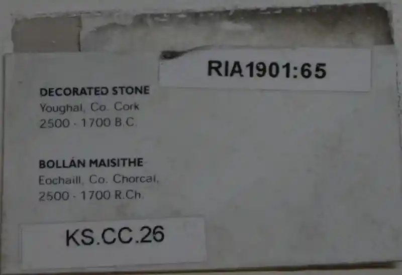 Solar disc sith a six-pointed symbol on a stone